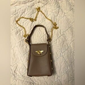 Small bag, can fit iPhone 
Mocha colour